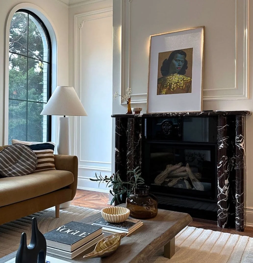 Gas fireplace installed in a vintage marble mantel